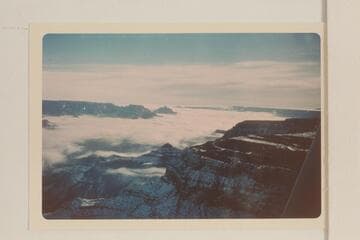 Up a clouded Grand Canyon from the South Rim below the Village. Cape Royal, Wotans Throne, and Vishnu Temple at left center