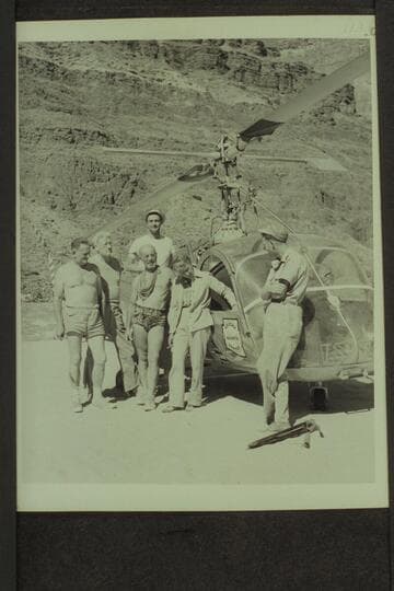 Helicopter and crew on beach at Tapeats Creek. Left to right: Taylor, Desloge, Marston, Forcier, Margaret Marston and Red Carson