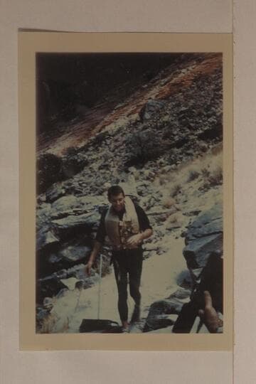Bill Beer preparing for "swim" through Hance Rapid. Hance was the only rapid which Beer and Daggett did not swim in 1955