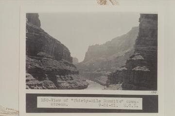 Down to Thirty-Mile Damsite from the upstream side of CoVe CAnyon. The beach where Chenoweth Viewed the D. Julien inscription is in the shadow of the oVerhang at the left bank at lower margin