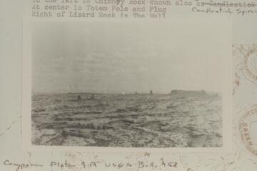 Canons in Coconino Sandstone and outliers of lower Moencopie. From Shinarump Bench, Upper Ernies Country.The long butte at right is Lizard Rock. In front of Lizard Rock is The Train. To left is Chimney Rock, also known as Candlestick Spire