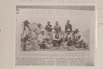 Douglass party eating melons in Piute Canyon. Return from Rainbow Bridge