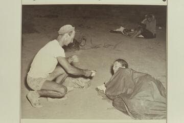 Norm Nevills serves coffee to Anne Desloge for the benefit of Bureau of Reclamation photographer William S. Russell. End of 1947 Traverse of Grand Canyon at Pierces Ferry