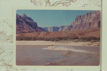 The "Kiwi" cruising up river at Mile 68.3. Dock Marston rides at left, Jim Bechtel is center, Jon Hamilton at the wheel, Temple Butte is upper left and Espejo Butte is upper right