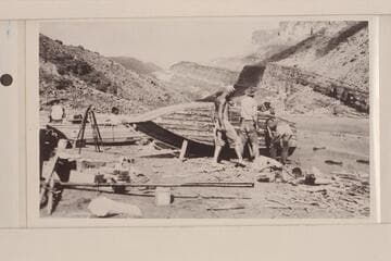 Boat repairs on lower Hance beach. Left to right: Moore, LaRue, Dodge, Burchard, Freeman and Lint