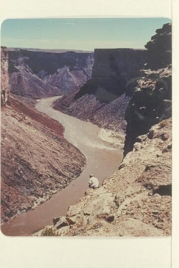 Soap Creek Rapid--Browns Riffle in the distance. Chuck Richey takes a picture from under the Rim. Preliminary Lees Ferry gauge: 87,600 cfs