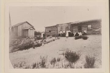 First church in Bluff. Harshberger wrote on back: Old Cabin Home, Bluff, Utah