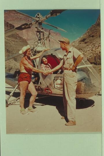 The helicopter on the beach at Tapeats Creek. Left to right: Dock Marston, Margaret Marston and Red Carson