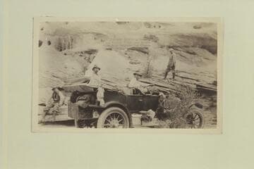 The Zahn party and their Franklin car in Copper Canyon en route from Kayenta to the Zahn Mine on the San Juan River. "In Copper Canyon showing the rough stuff"