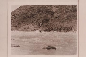 Cooper running the "Sweet Chariot" through Dubendorff Rapid. The flow approximates 30,000 cfs