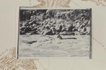 Spectre Canyon Rapid; Les Jones upset. Note the freed oar