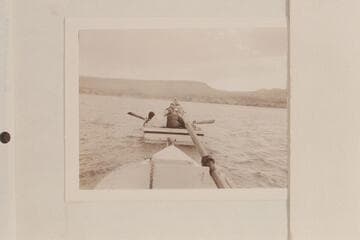 Boats being towed into Pierces Ferry by Greene. Anne Desloge lies on deck with Al Milotte facing her