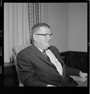 Man seated at desk