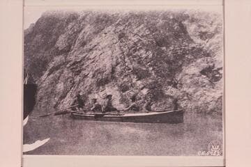 The "Bonnie Jean" below Crystal Creek. Stanton in the bow; Kane as bow oarsman; Ballard sittiing on the deck amidships, Gibson as stroke and Hogue as sweep