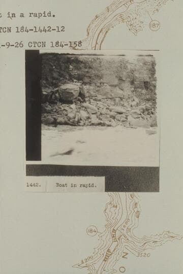 Boat in Rapid 43 at Mile 184.1. Photo captioned "Boat in a rapid."
