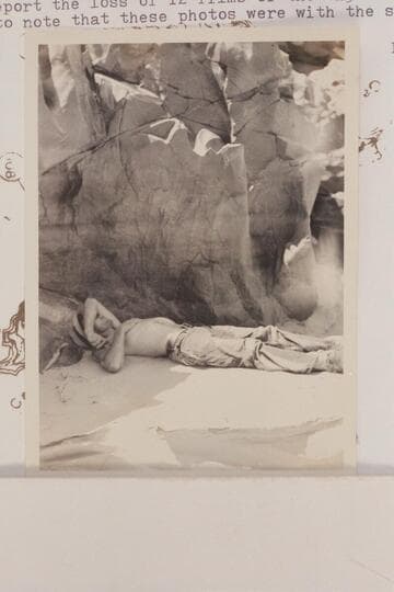 Frank Swain asleep under an overhang at head of Serpentine Rapid. Noon stop. Eddy's photo notes report the loss of 12 films of the 4x5 size but he may have failed to note that these photos were with the smaller camera