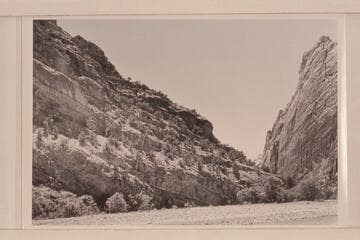 Lower end of Canyon of Lodore at Pats Hole; Echo Cliff on right. 1871, June 28, Steward and Clem had their fracas with a whirlpool along this shore at the left