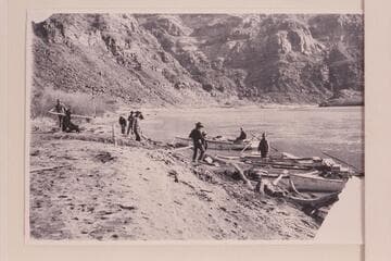 Stanton's boat at Lees Ferry. The far boat has two steering oars. The skiff used by Galloway, Stone and Knox in 1898, Nov., had two oarlocks on the stern