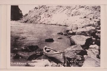 Portion of Photo No. 54 of Brown Survey in Cataract Canyon. Shows the type of boat provided by Brown for the traverse of Cataract Canyon, Glen, Marble, and the Grand Canyons. At head of Rapid No. 23; Mile 202.20, Cataract Canyon
